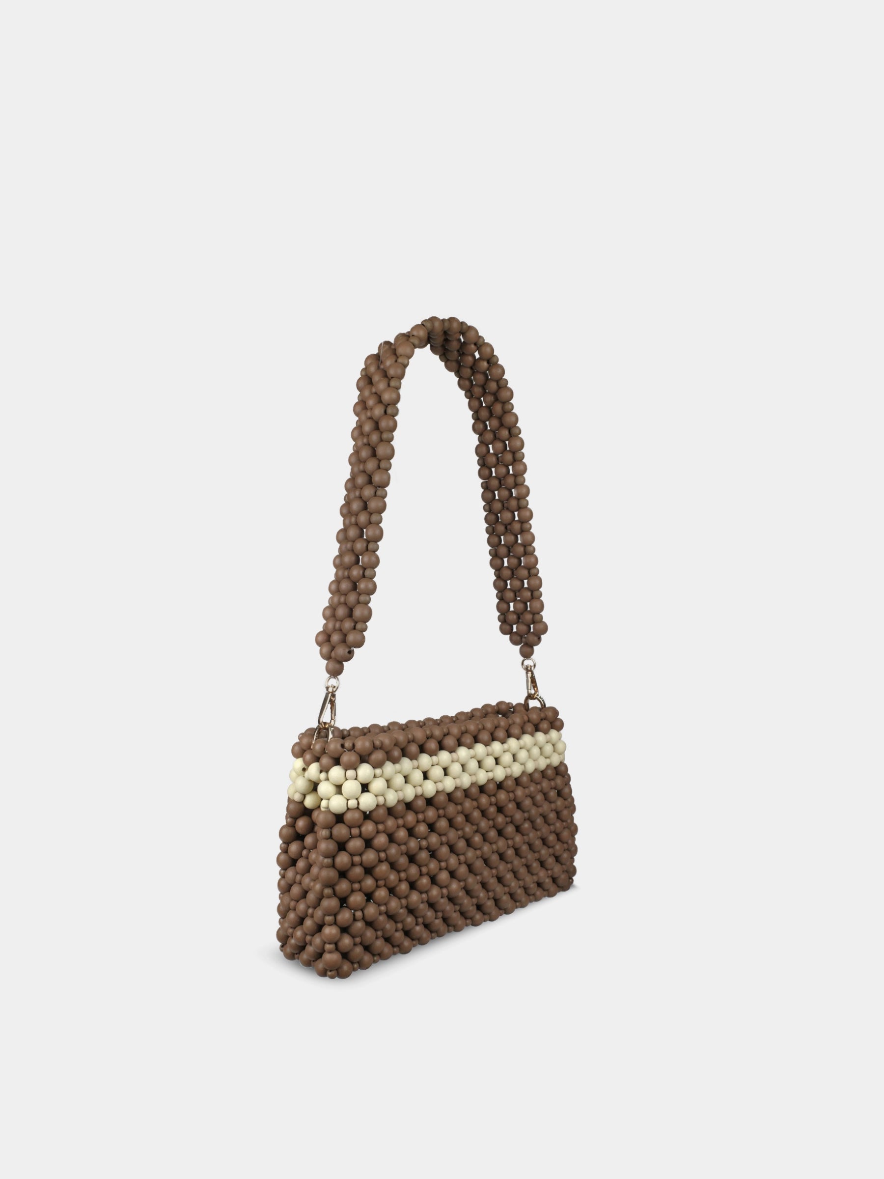 Brown beaded handbag with a cream-colored section on a light gray background
