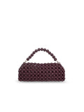 A small structured handbag covered in burgundy wood beads, featuring a matching beaded top handle and gold-tone hardware, set against a plain white background.
