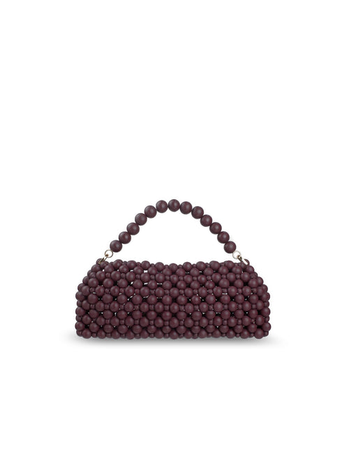 A small structured handbag covered in burgundy wood beads, featuring a matching beaded top handle and gold-tone hardware, set against a plain white background.