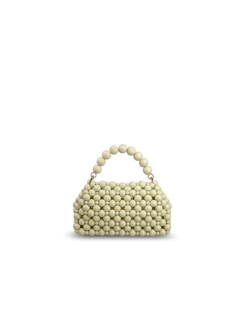 A small structured handbag covered in milk white wood beads, featuring a matching beaded top handle and gold-tone hardware, set against a plain white background.