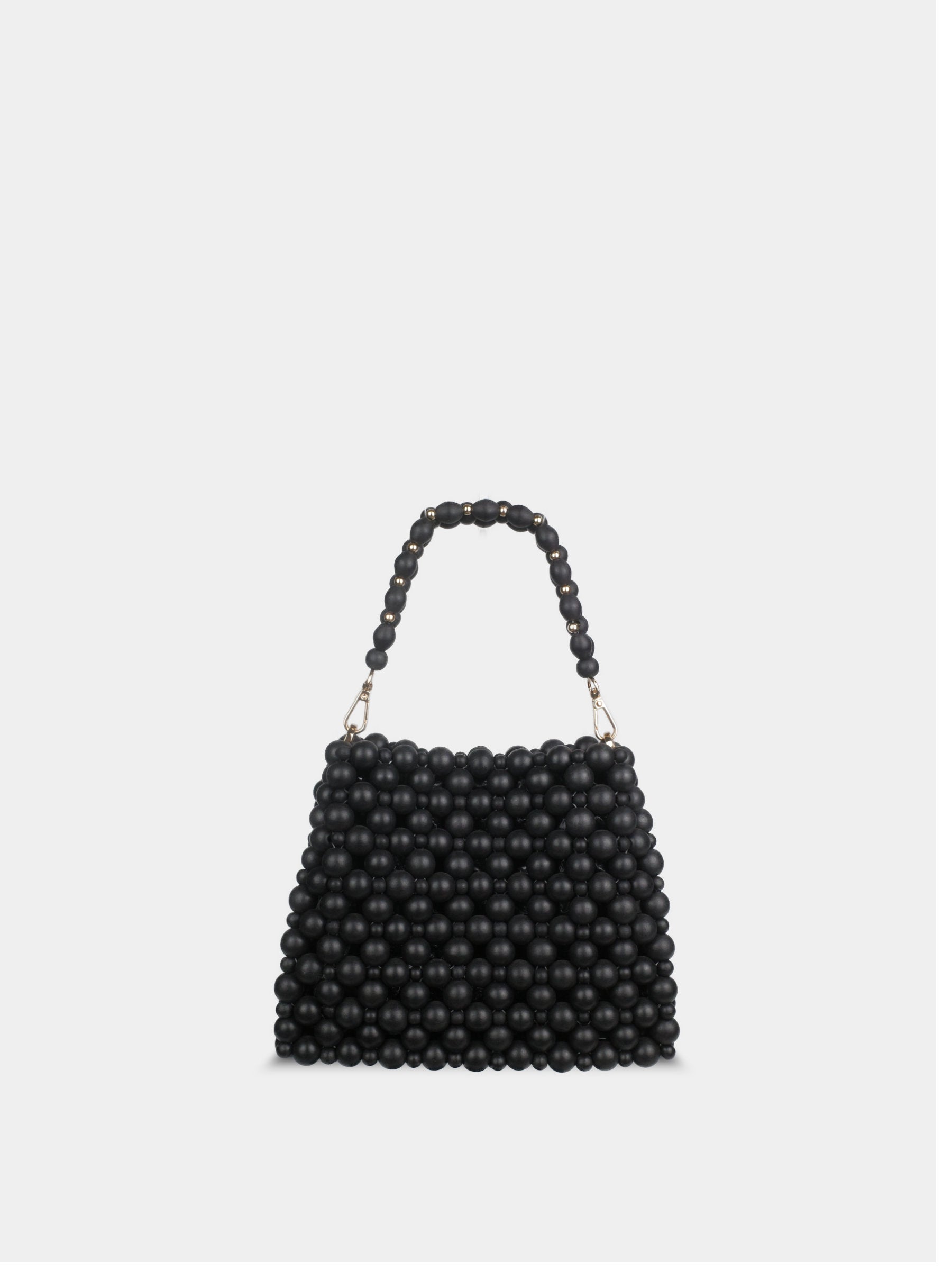 Black beaded handbag on a light gray background
