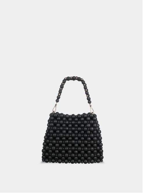 Black beaded handbag on a light gray background