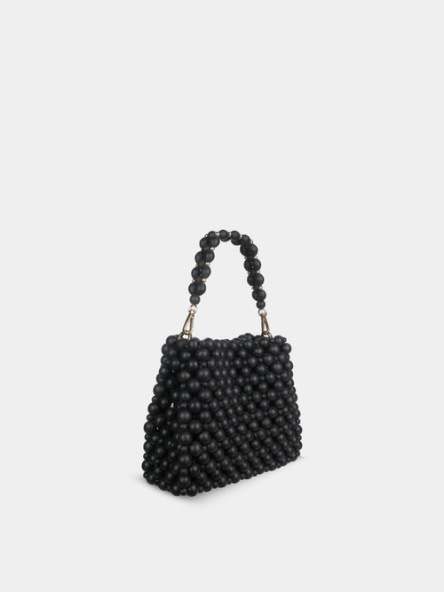 Black beaded handbag on a light gray background