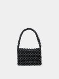 Black beaded handbag on a light gray background