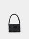 Black beaded handbag on a light gray background
