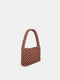Brown beaded handbag on a light gray background