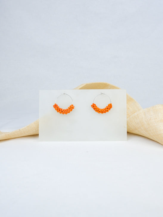 Orange handmade wood hoop woven beads statement dangling earrings