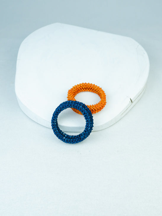 handowen bead memory wire bracelet in blue and orange